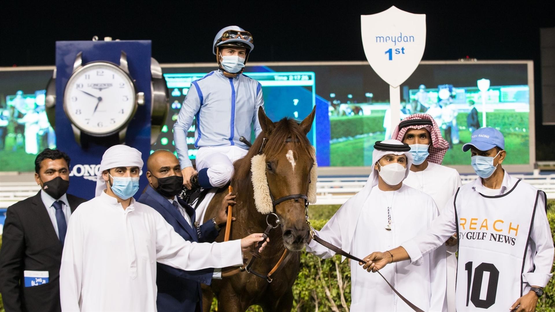 Book Review (GB) (Salem bin Ghadayer - Mickael Barzalona) wins the REACH by Gulf News - 2200m, handicap race at the eighth Racing at Meydan meeting on January 30, 2021. (Credit: Erika Rasmussen//DRC))