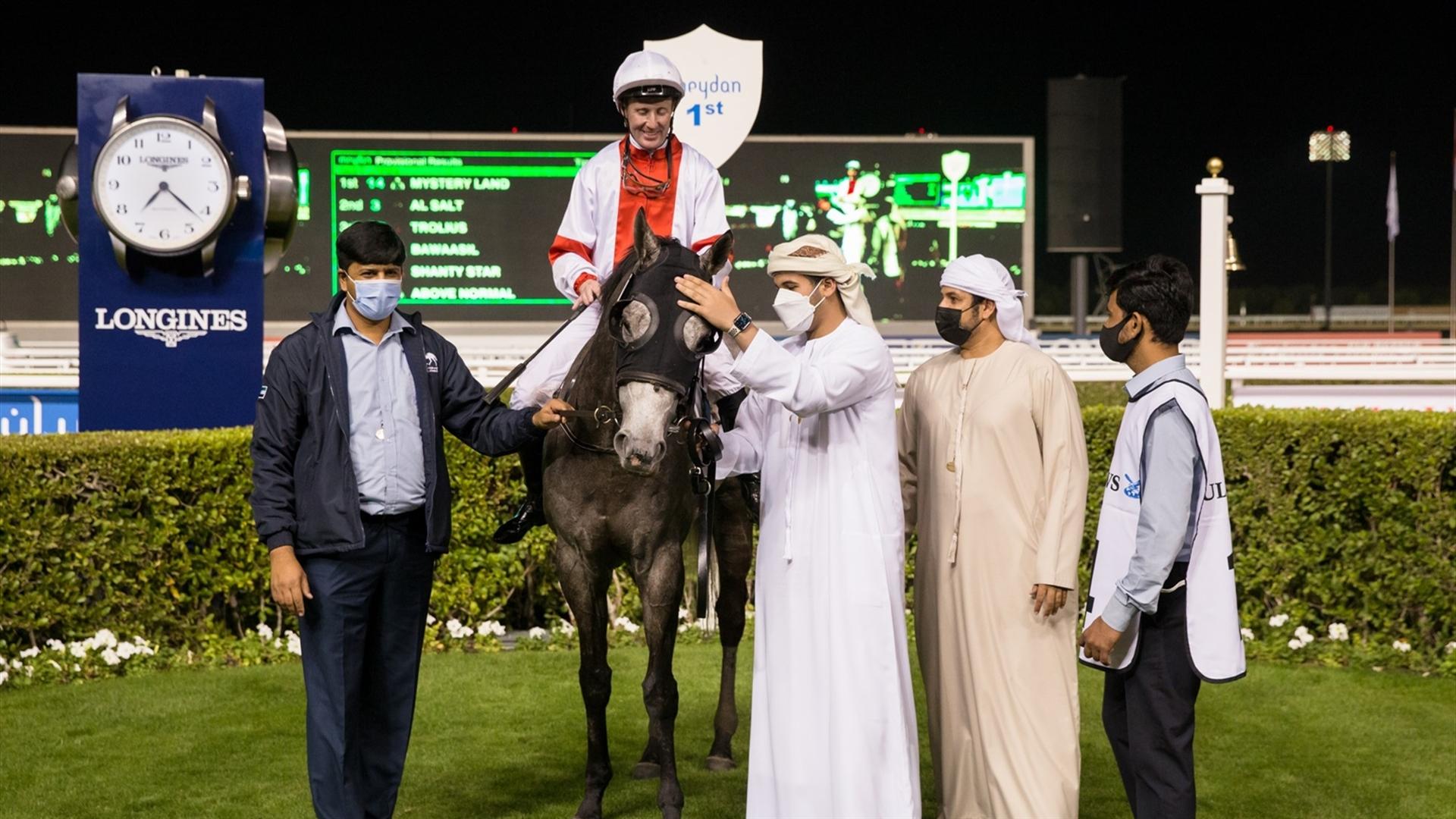 Mystery Land (GB) (Helal Alalawi - Patrick Cosgrave) wins the Gulf News race at the eighth Racing at Meydan meeting on January 30, 2021. (Credit: DRC // Erika Rasmussen)