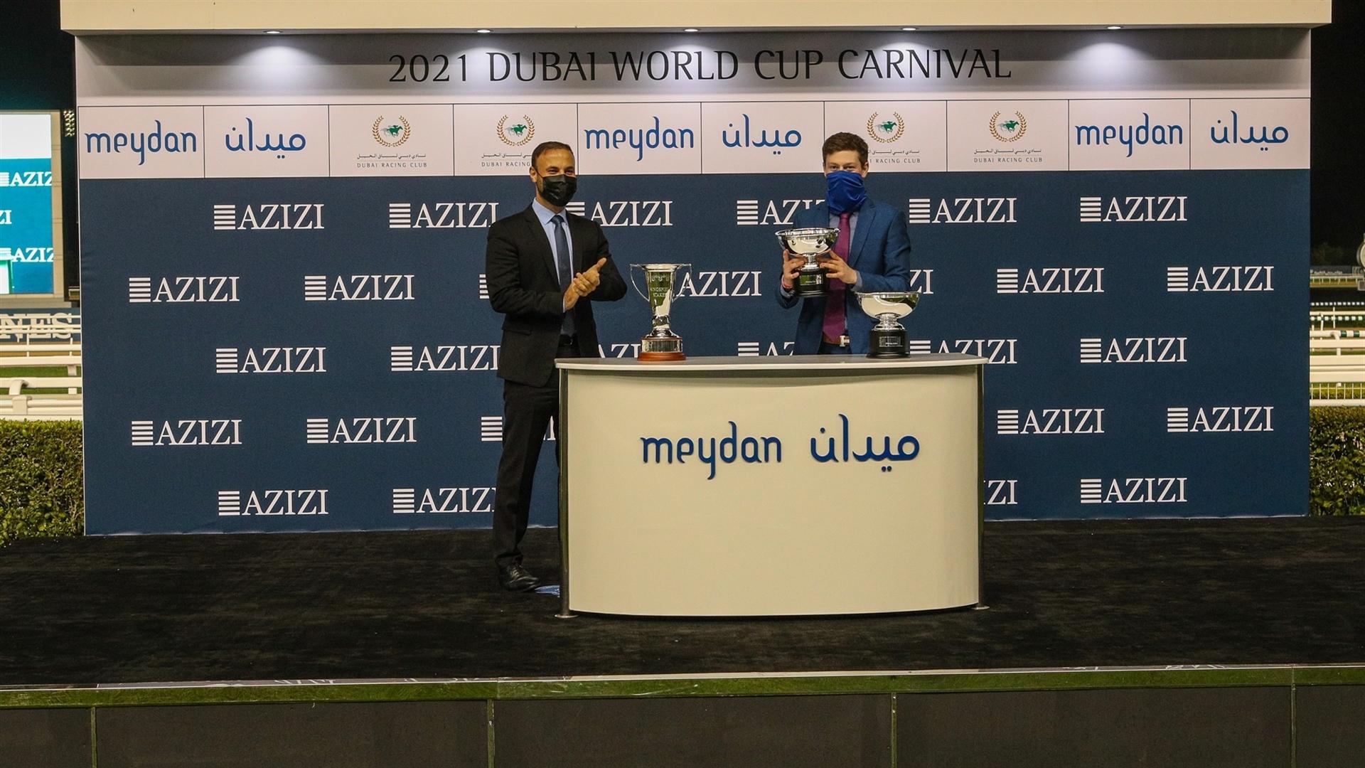 Mathew Ennis accepts the trophy for the Singspiel Stakes Sponsored By Riviera By Azizi, from Mr. Farhad Azizi, CEO, Azizi Developments, on January 21, 2021. (Credit: DRC)