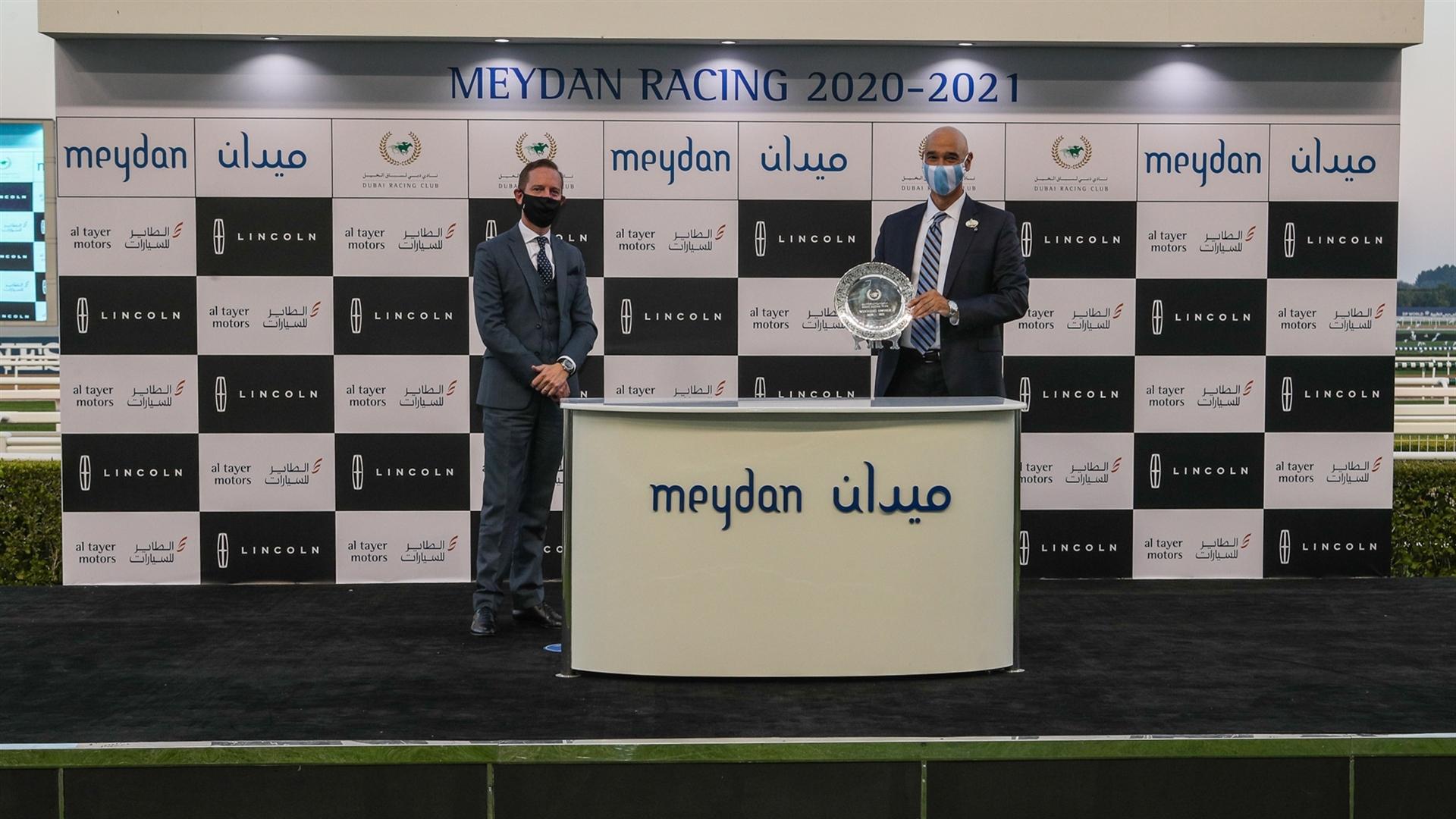Sayed Hashish accepts the trophy for the Lincoln Continental, from Mr. Keith Phillips, Sales Manager, Al Tayer Motors Lincoln, on January 16, 2021. (Credit: Dubai Racing Club)