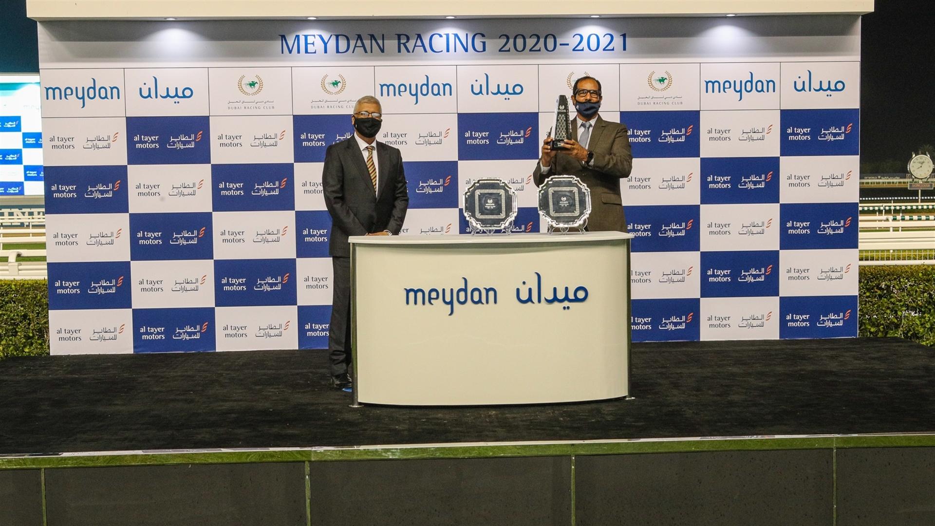 Maqsood Ali, Satish Seemar and Tadhg O'Shea accept the trophy for the Al Tayer Motors from Mr. Ashok Khanna, Chief Executive Officer, Al Tayer Motors, on January 16, 2021. (Credit: Dubai Racing Club)