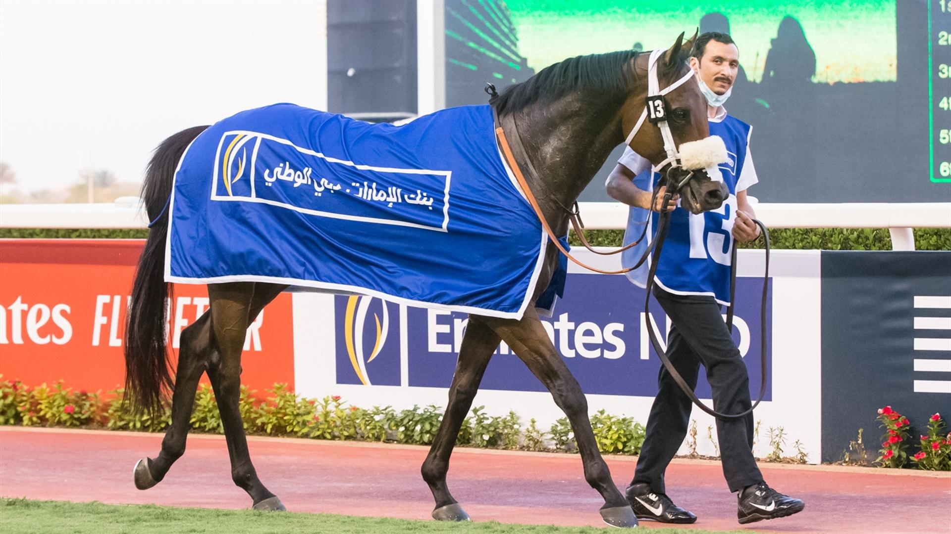 Bawaasil (GB) (Doug Watson - Sam Hitchcott) wins the Emirates NBD Handicap Sponsored By Emirates NBD race at the Eleventh Racing at Meydan meeting on April 8, 2021. (Credit:DRC // Erika Rasmussen)