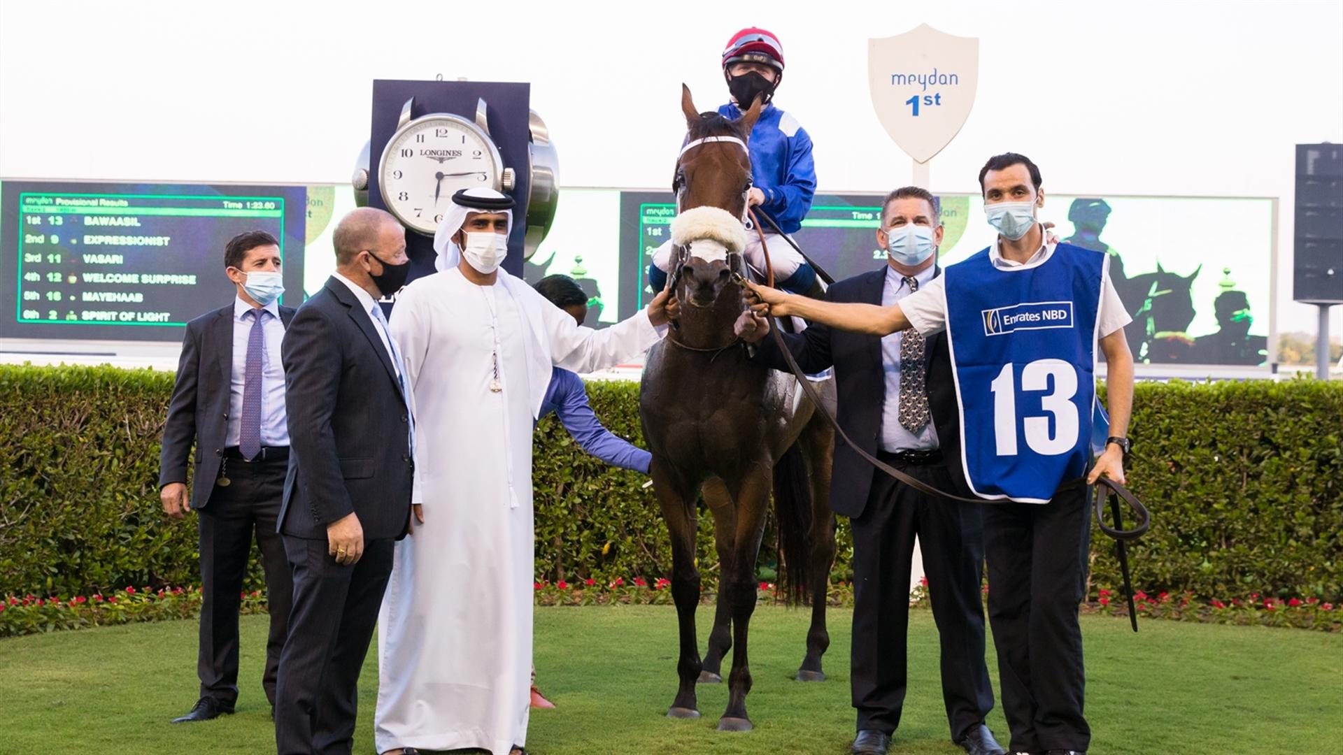 Bawaasil (GB) (Doug Watson - Sam Hitchcott) wins the Emirates NBD Handicap Sponsored By Emirates NBD race at the Eleventh Racing at Meydan meeting on April 8, 2021. (Credit:DRC // Erika Rasmussen)