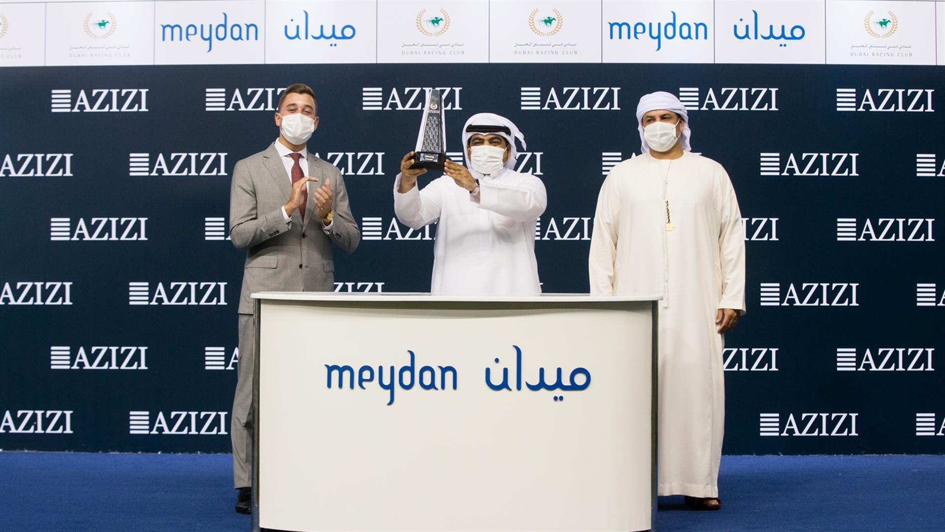 Abdallah Al Mamari accepts the trophy for the Azizi Developments Handicap Sponsored By Azizi Developments from Mr. Tizian H.G.Raab, Head of Public Relations & Comms, Azizi Developments(Credit:DRC//ER)