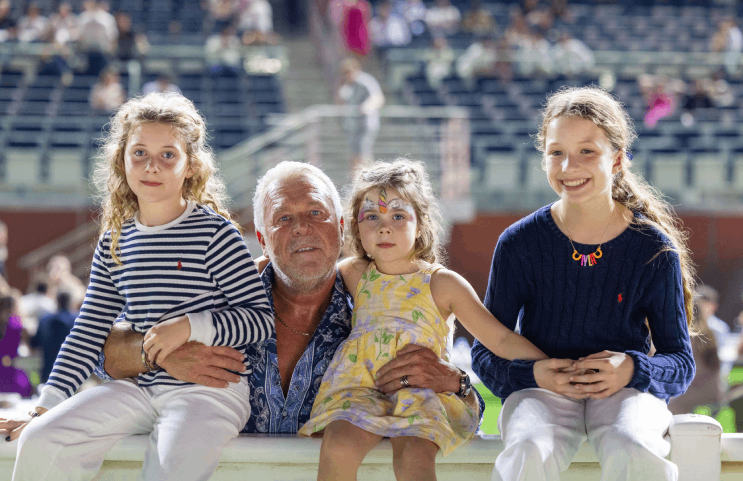 Family enjoying races from racecourse box