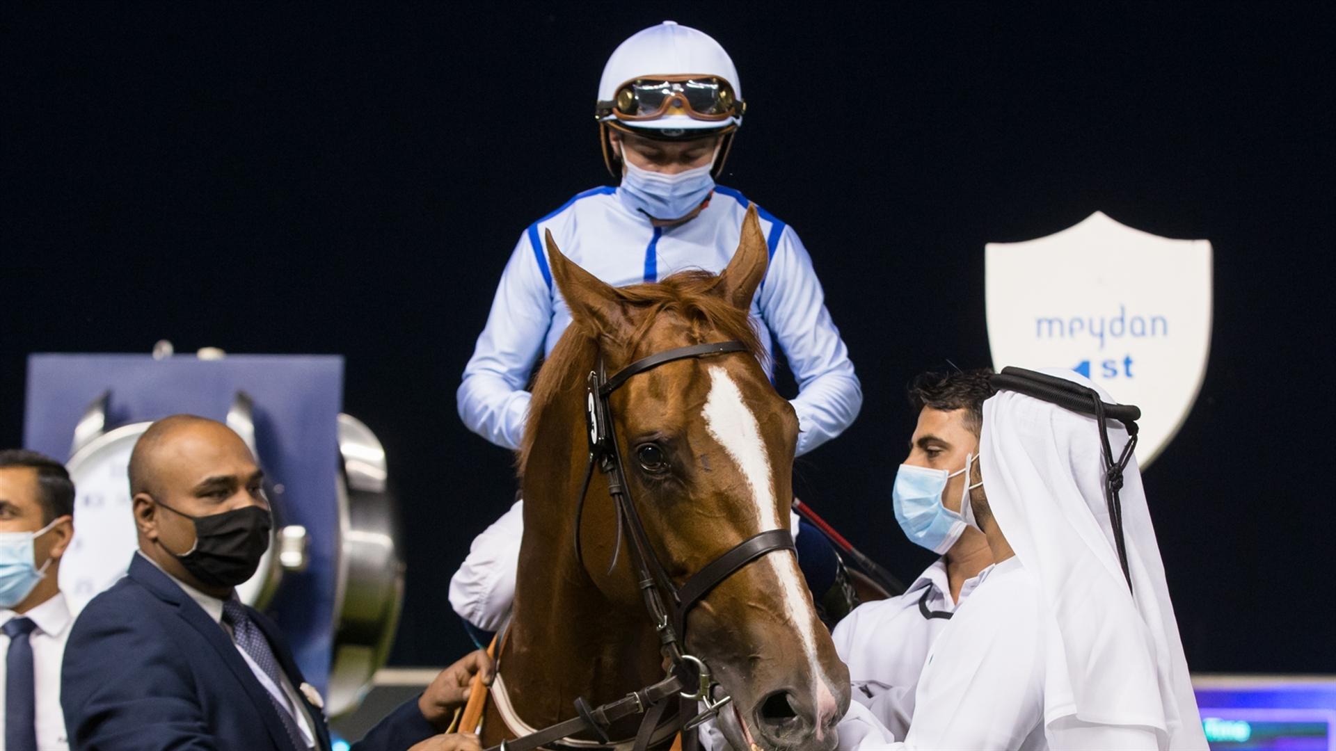 Hypothetical (IRE) (Salem bin Ghadayer - Mickael Barzalona) wins the New Jaguar XF, 1600m Handicap race at the Fifth Dubai World Cup Carnival on February 18, 2021. (Credit: Erika Rasmussen//DRC)