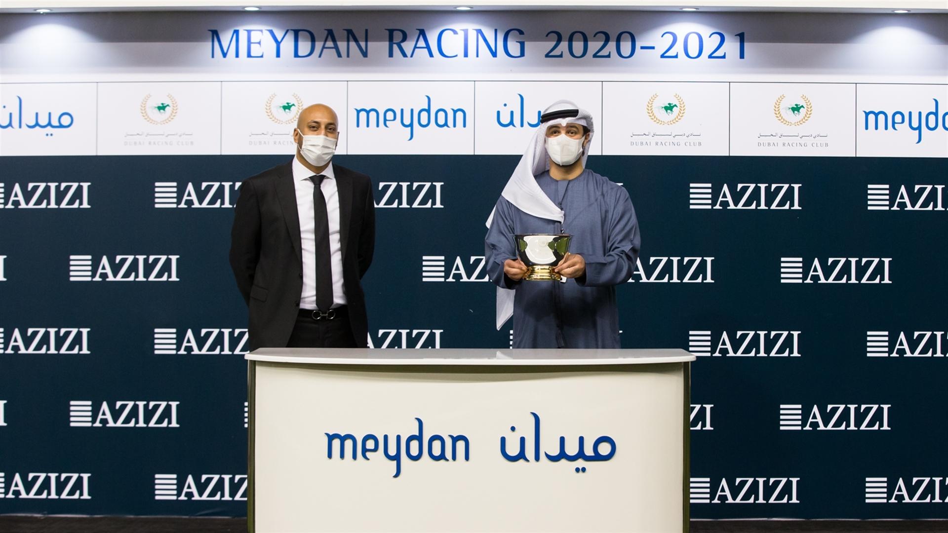 Winning owner, Marwan Abdul Rahman accepts the trophy for the Berton By Azizi, from Mr. Nima Khajasteh, Executive Director of Sales & Mkt, on March 11, 2021. (Credit: DRC // Erika Rasmussen)