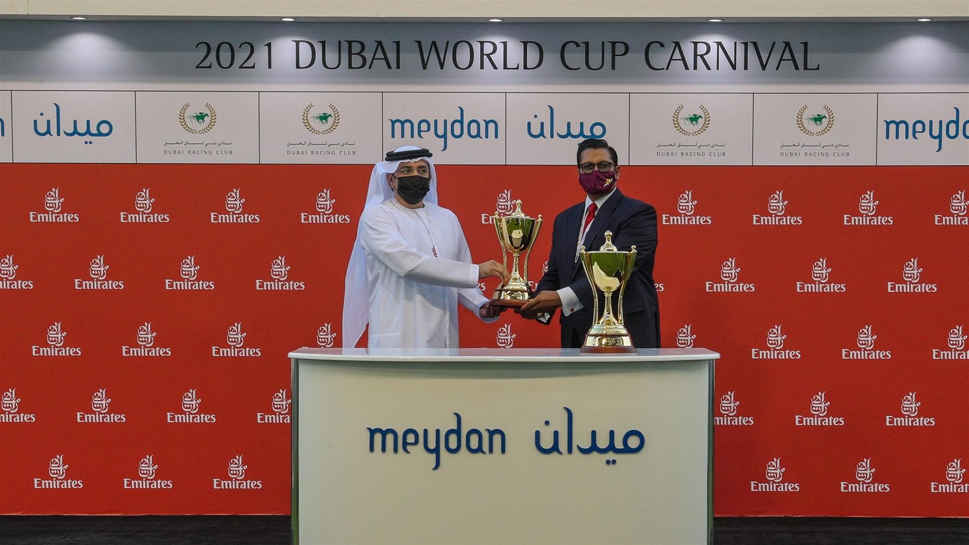 Satish Seemar accepts the trophy from Mr.Mohammed Ahmed bin Abdulaziz Al Shehhi, Vice Chairman,Dubai Racing Club for the ERA '19-'20 Leading Trainer Award at the 7th DWCC on Mar 06, 2021.(Credit:DRC)