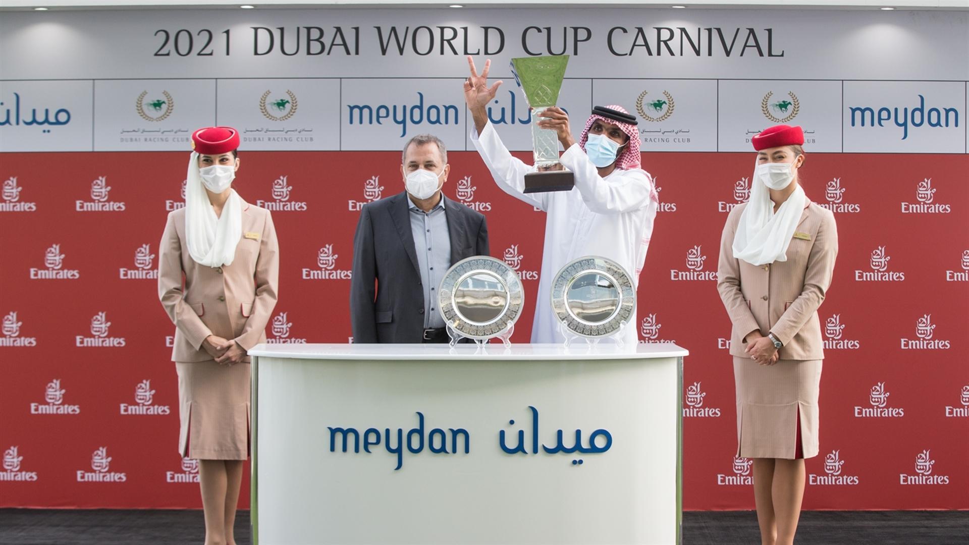 Salem bin Ghadayer accepts the trophy for the Al Bastakiya Sponsored By Arabian Adventures, from Boutros Boutros, Div. Sen. VP - Corp. Comms, Mktg & Brand on Mar 06, '21. (Credit:Erika Rasmussen//DRC)