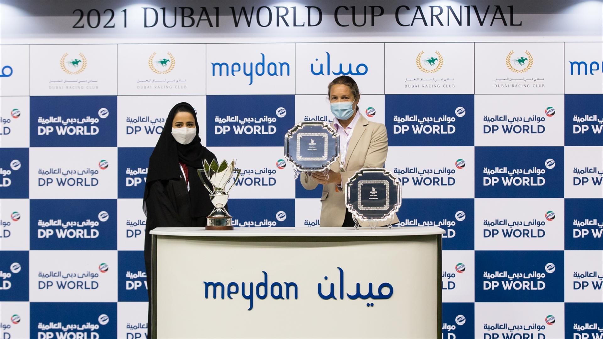 Sophie Chretien accept the trophy for the Dubai Sprint Sponsored By JAFZA from Ms. Ebtesam Al Kaabi, Head of Sales - JAFZA on February 4, 2021. (Credit: Erika Rasmussen//Dubai Racing Club)