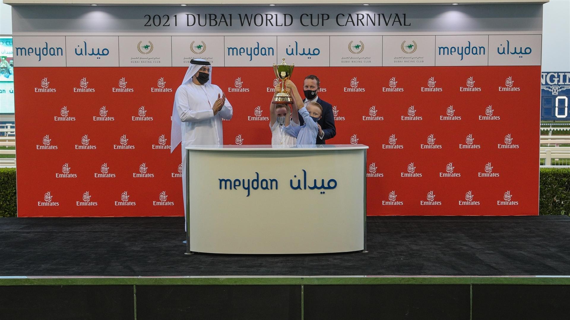 Tadhg O'Shea accepts the trophy from Mr.Mohammed Ahmed bin Abdulaziz Al Shehhi, Vice Chairman,Dubai Racing Club for the ERA '19-'20 Leading Jockey Award at the 7th DWCC on Mar 06, 2021.(Credit:DRC)
