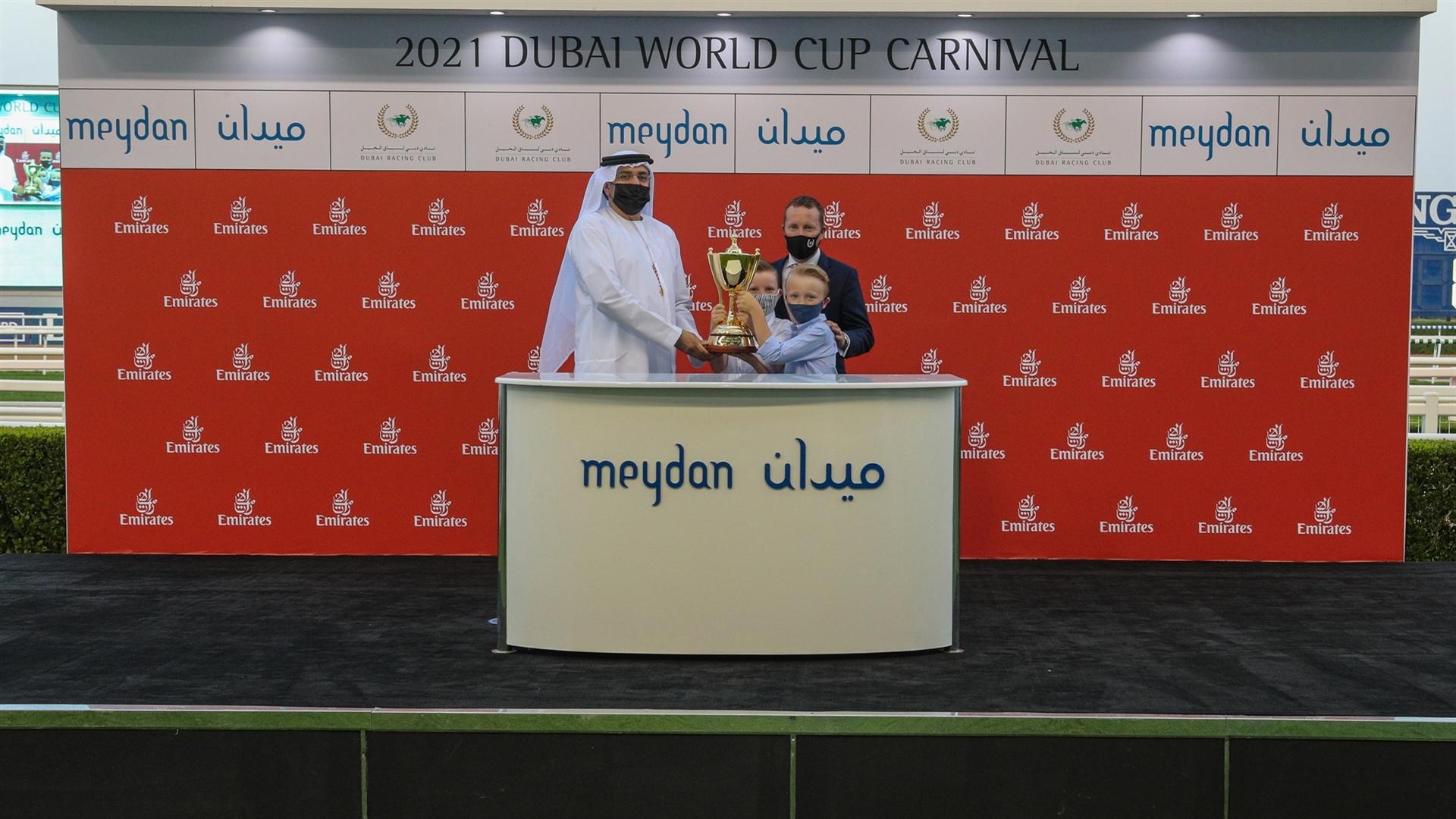 Tadhg O'Shea accepts the trophy from Mr.Mohammed Ahmed bin Abdulaziz Al Shehhi, Vice Chairman,Dubai Racing Club for the ERA '19-'20 Leading Jockey Award at the 7th DWCC on Mar 06, 2021.(Credit:DRC)