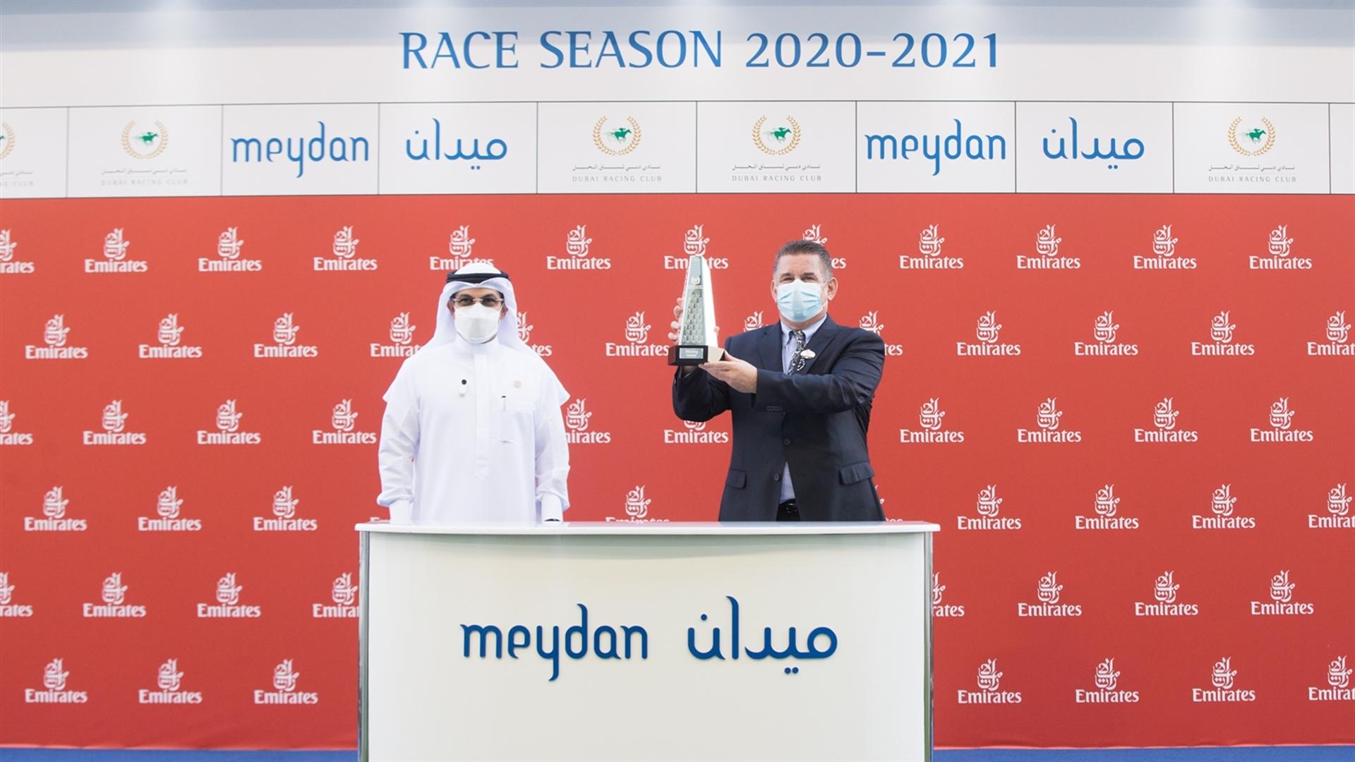 Winning trainer, Doug Watson accepts the trophy for the Emirates Stakes Sponsored By Emirates Airline on April 8, 2021. (Credit: DRC // ER)