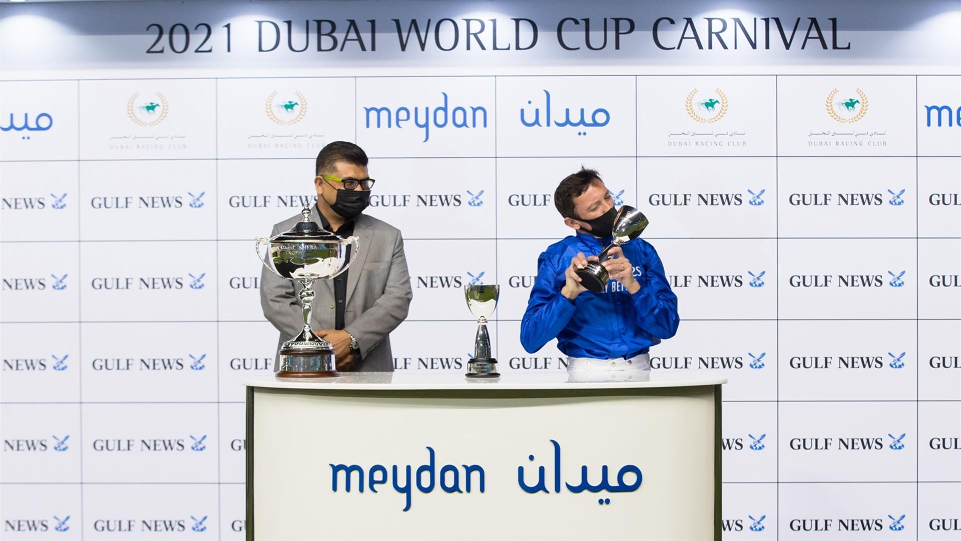 Lanfranco Dettori accepts the trophy for the Nad Al Sheba Trophy Sponsored By Gulf News from Anshuman Joshi, Director-Sales & Publishing on February 25, 2021. (Credit: Erika Rasmussen//DRC)