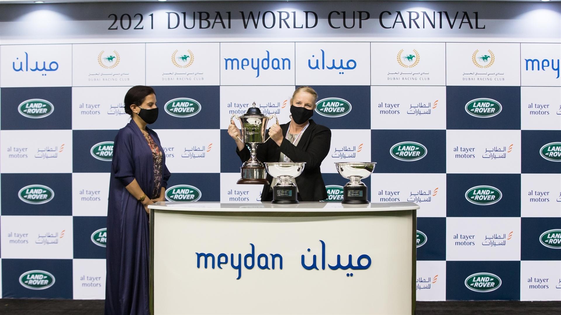 Nicola Dowell accepts the trophy for the Meydan Sprint Sponsored By Land Rover, from Ms. Mona Sadoun, VP Customer Experience & Marketing, Al Tayer Motors on Feb 18, 2021. (Credit:Erika Rasmussen//DRC)