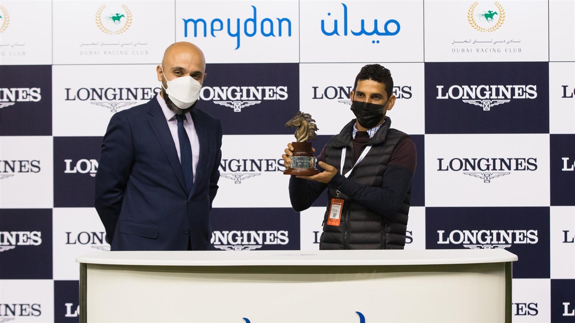 Hussain Abdulla accepts the trophy for the Longines Spirit Collection Challenge from Mr. Patrick Aoun, Regional Brand Manager, on February 13, 2021. (Credit: Dubai Racing Club // Erika Rasmussen)
