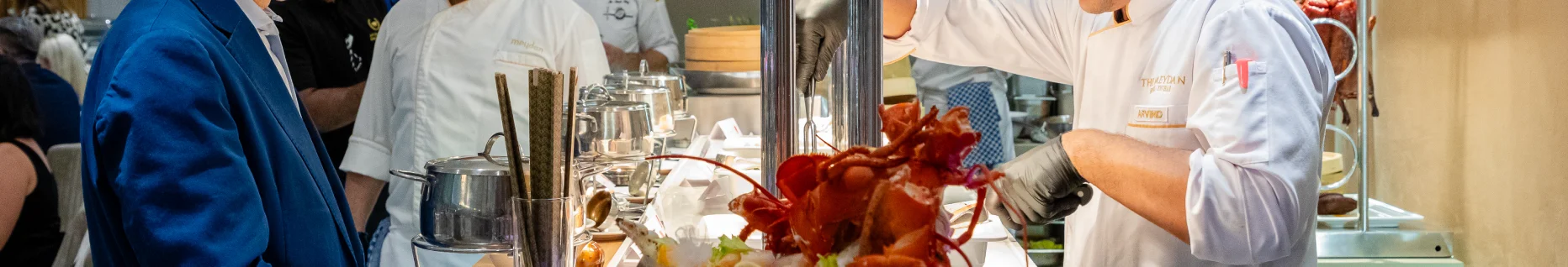 Chef serving fresh lobster at event