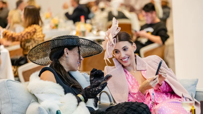 Stylish guests in elegant race day hats