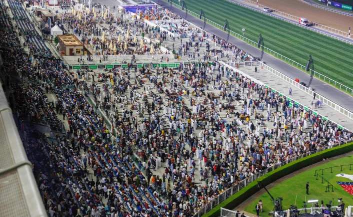 Spectators filling racecourse grandstands