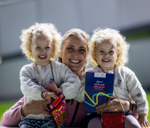 Family enjoying Kids Zone at racing event