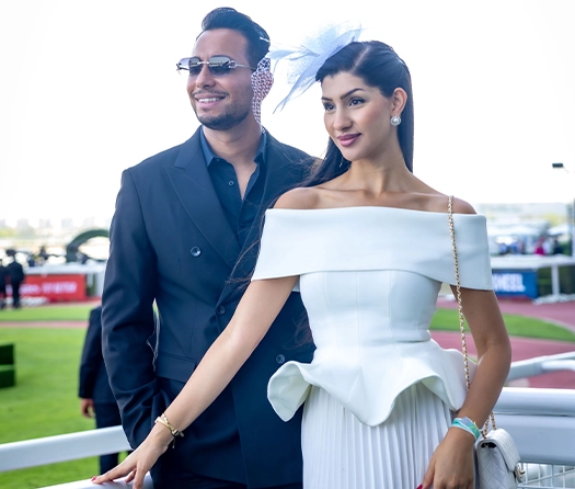 Couple dressed for Dubai Racing Club event