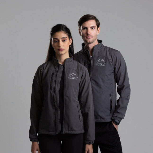 Two people wearing matching jackets.