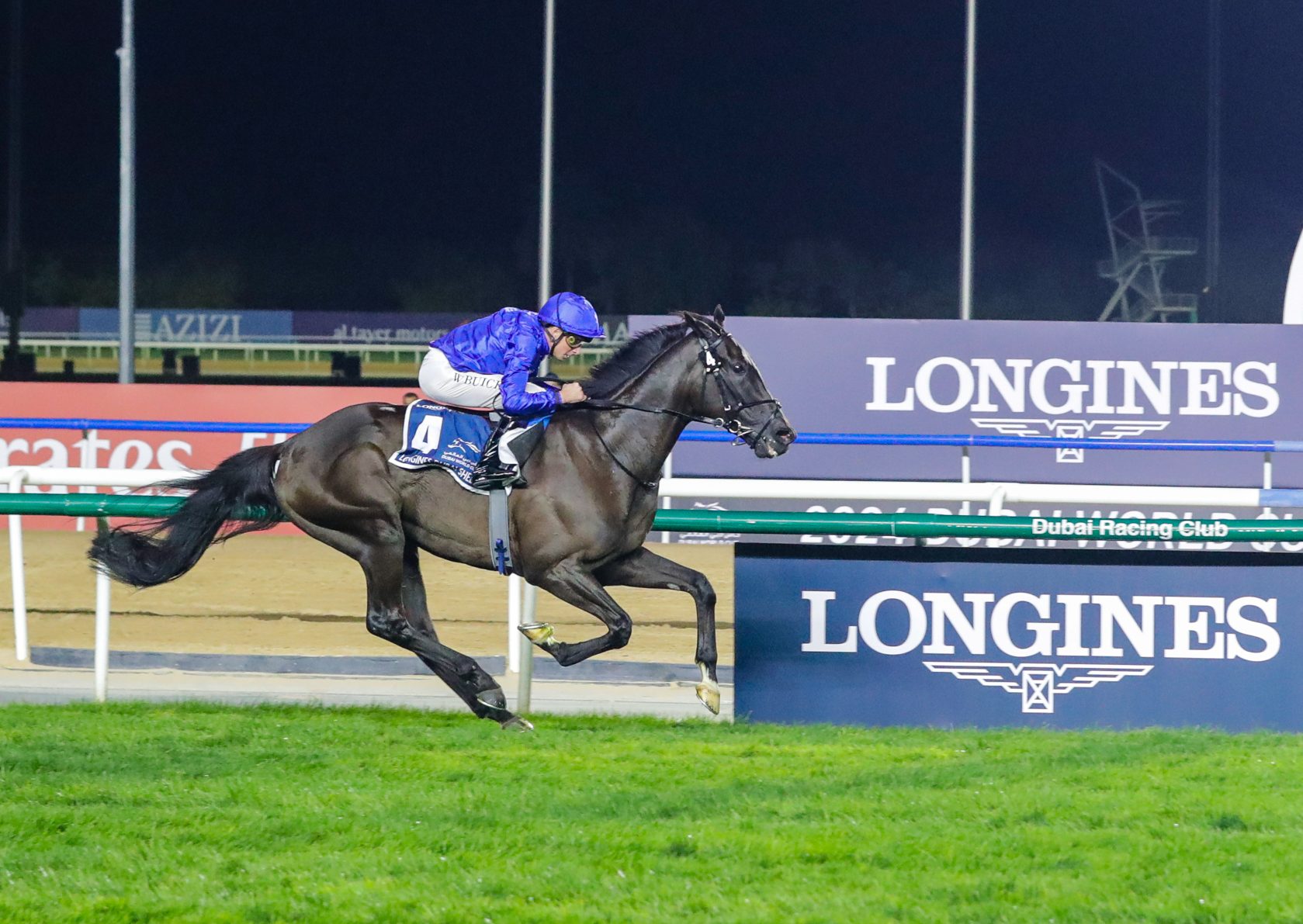 Horse racing at night, competitive atmosphere.