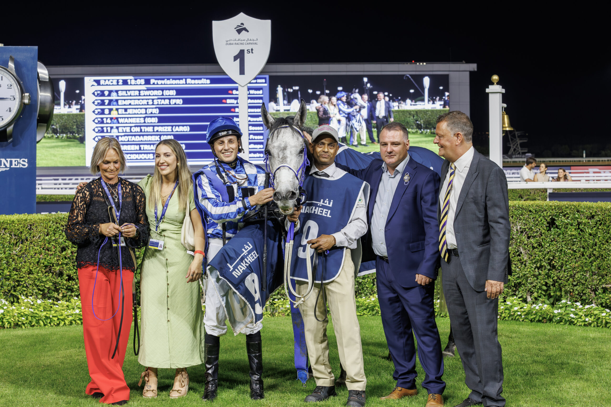 Horse racing winners celebration at night.
